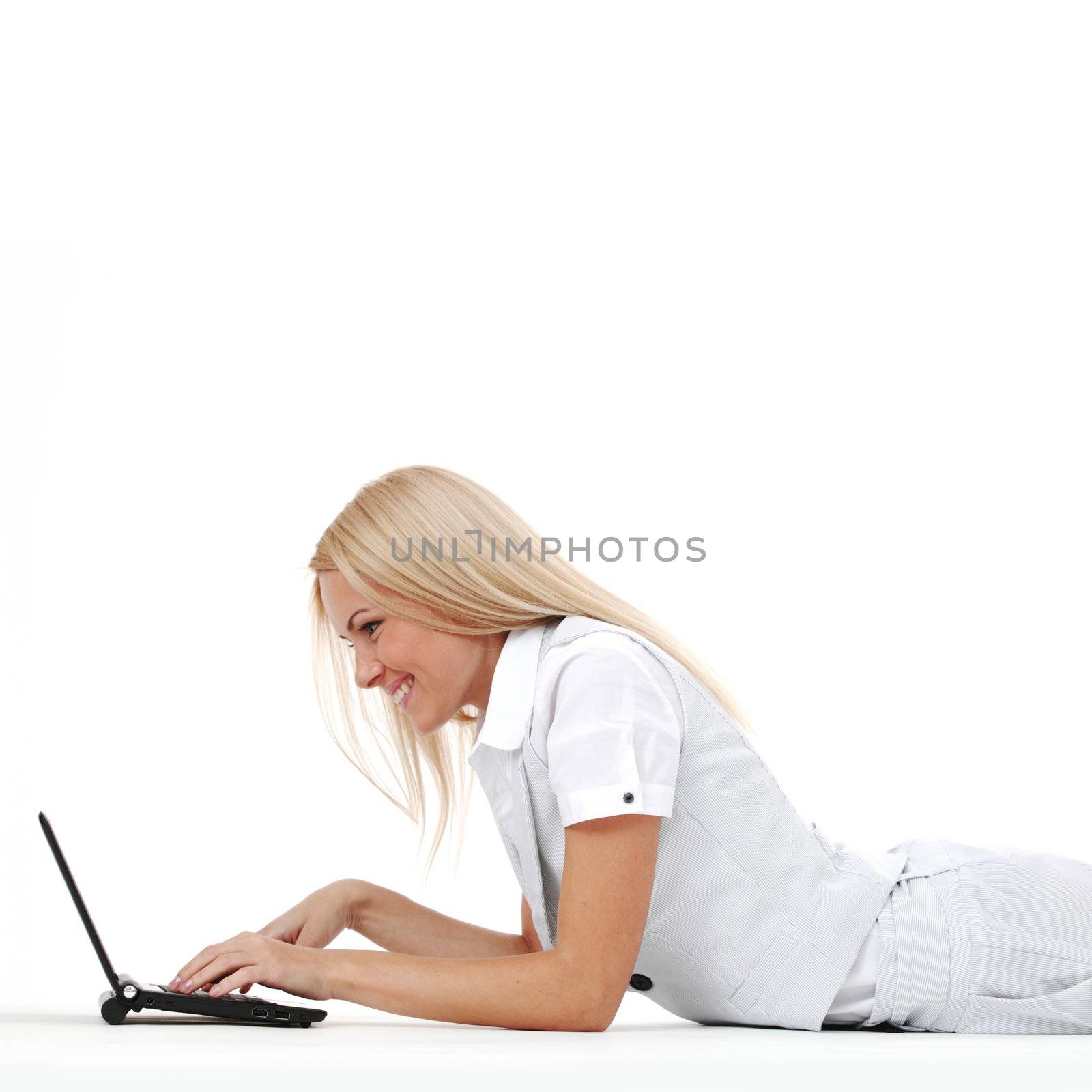 business woman lies and working on laptop