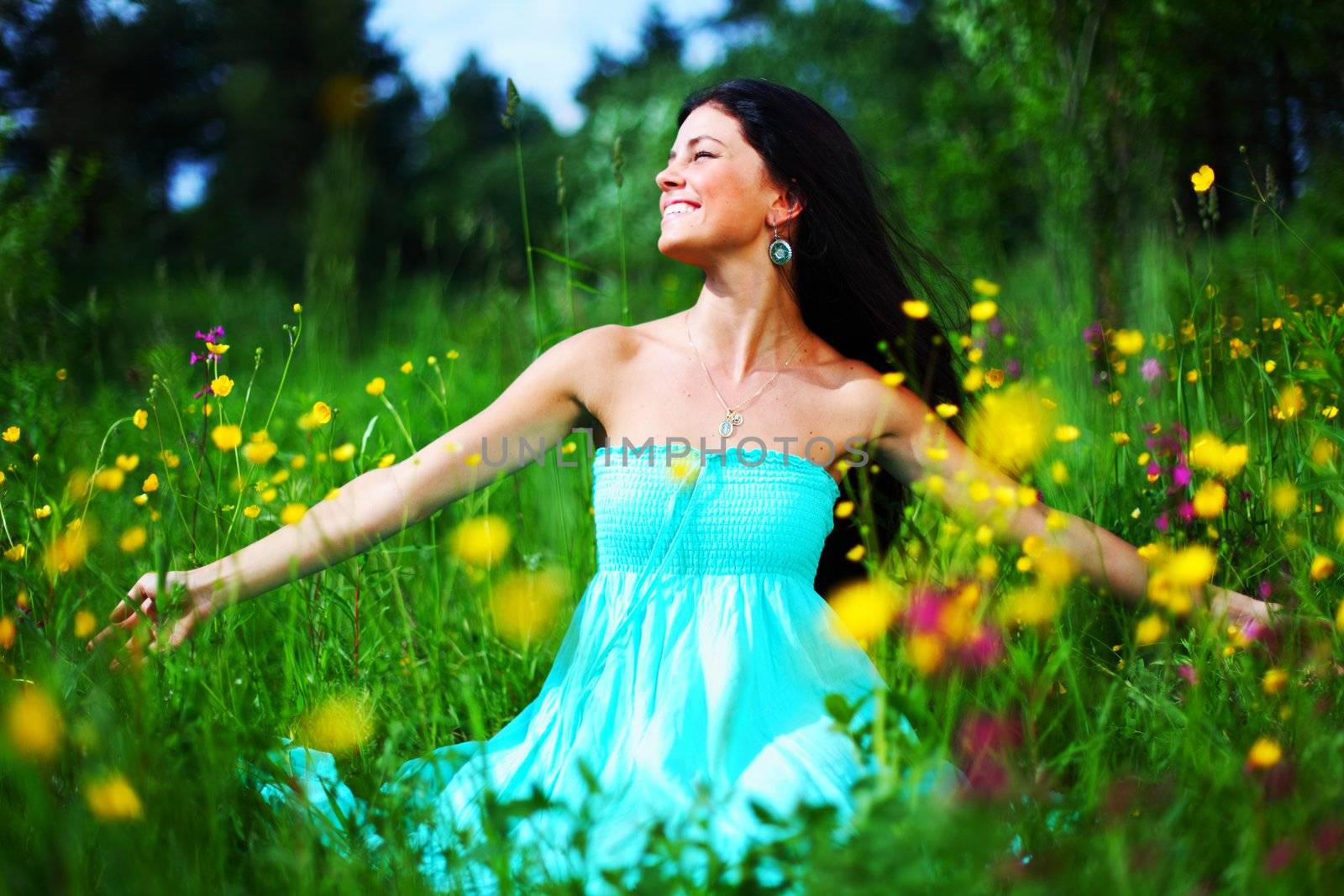 woman on summer flower field