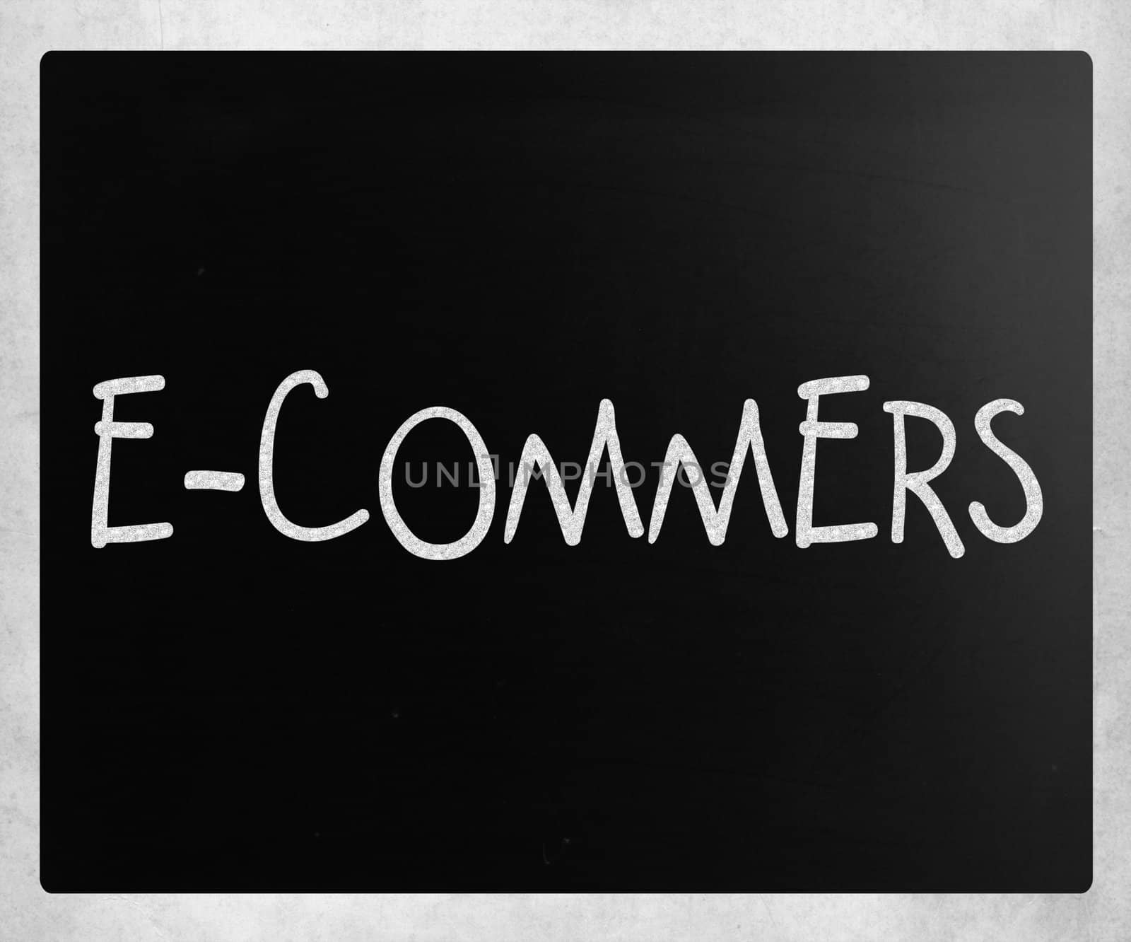 The word "E-commers" handwritten with white chalk on a blackboard
