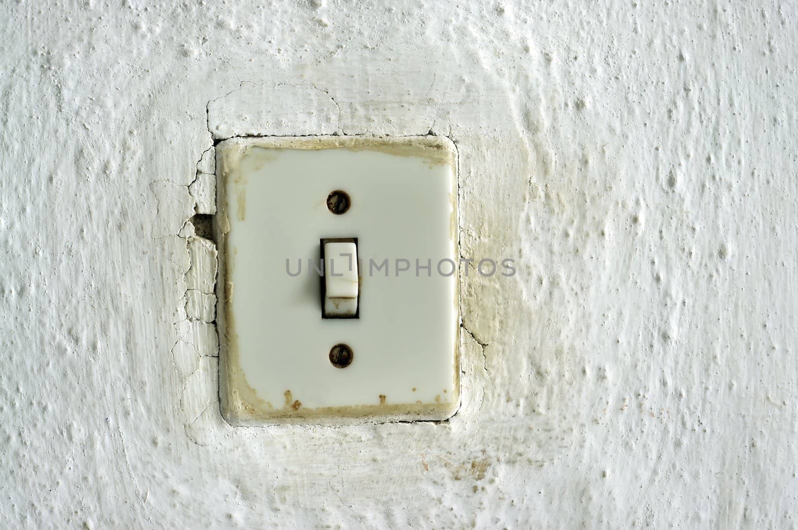 traditional old light switch on the wall