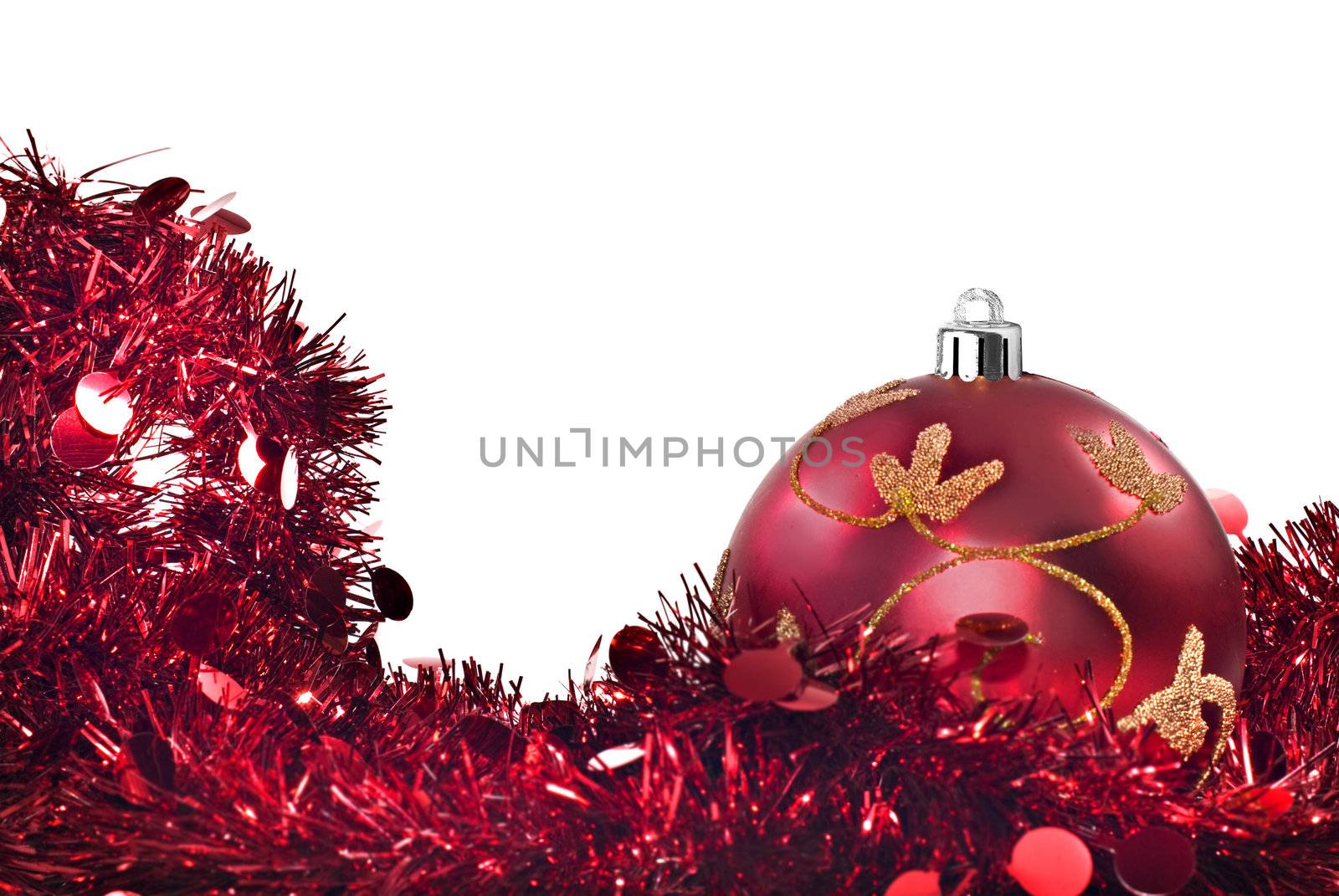 Red chrismas decorations against a withe background with space for text