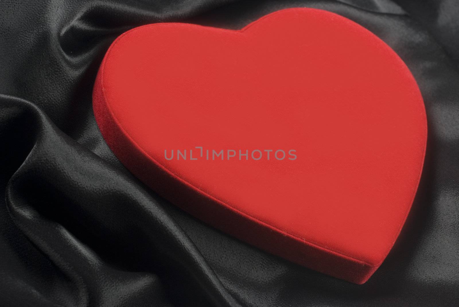 a Red heart on silky wavy fabric