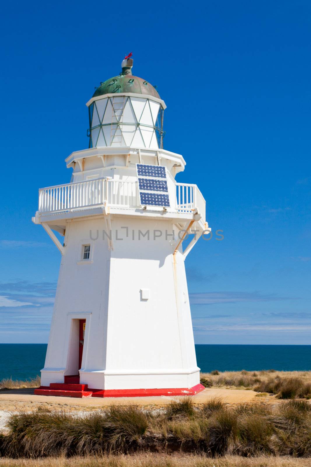 Beautifully restored heritage building of Wairapa Point Lighthouse on The Catlins coast on South Island of New Zealand