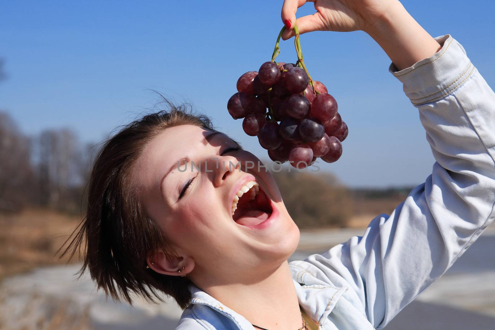 Girl Eating Grapes by kvkirillov