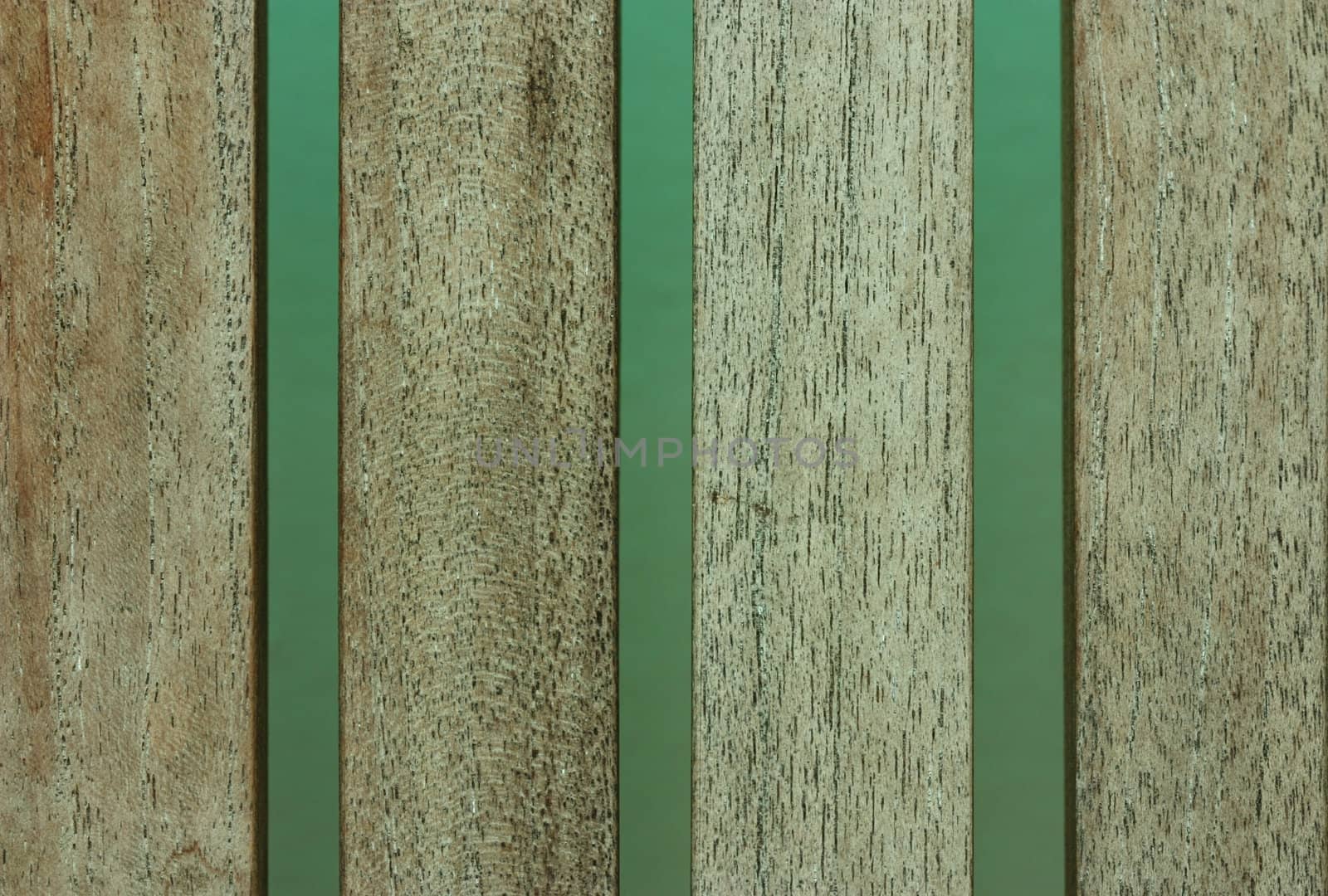 narrow wooden planks placed vertically at intervals