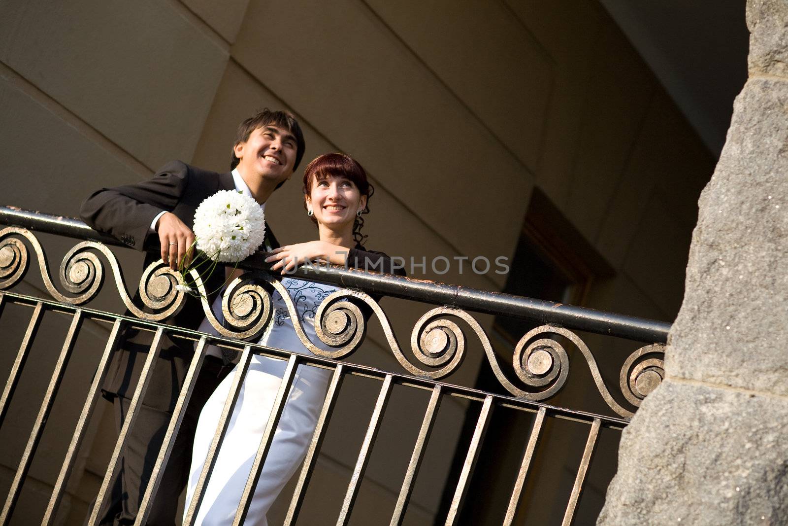 couple near the fence in the city