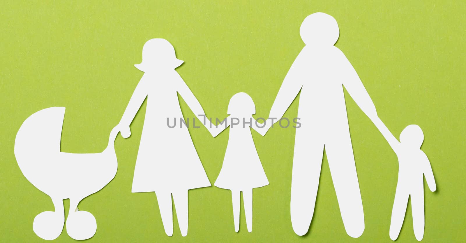 Closeup of paper family on green background