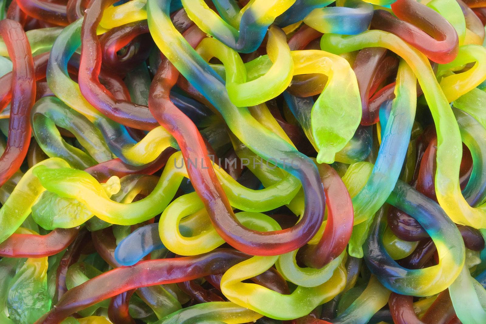 Background of jelly worms of different colors 