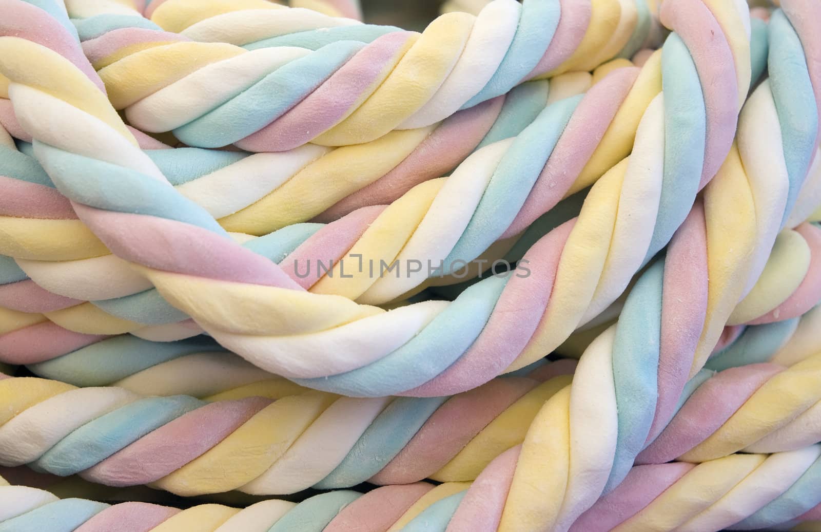Four-colored blue, pink, yellow, white marshmallow, close up