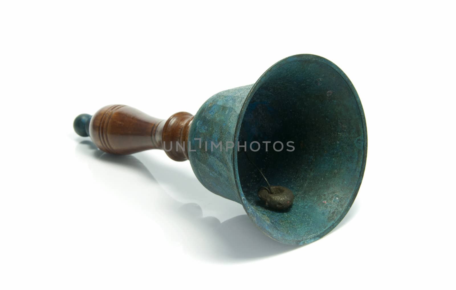 green metal and wooden bell on isolated white