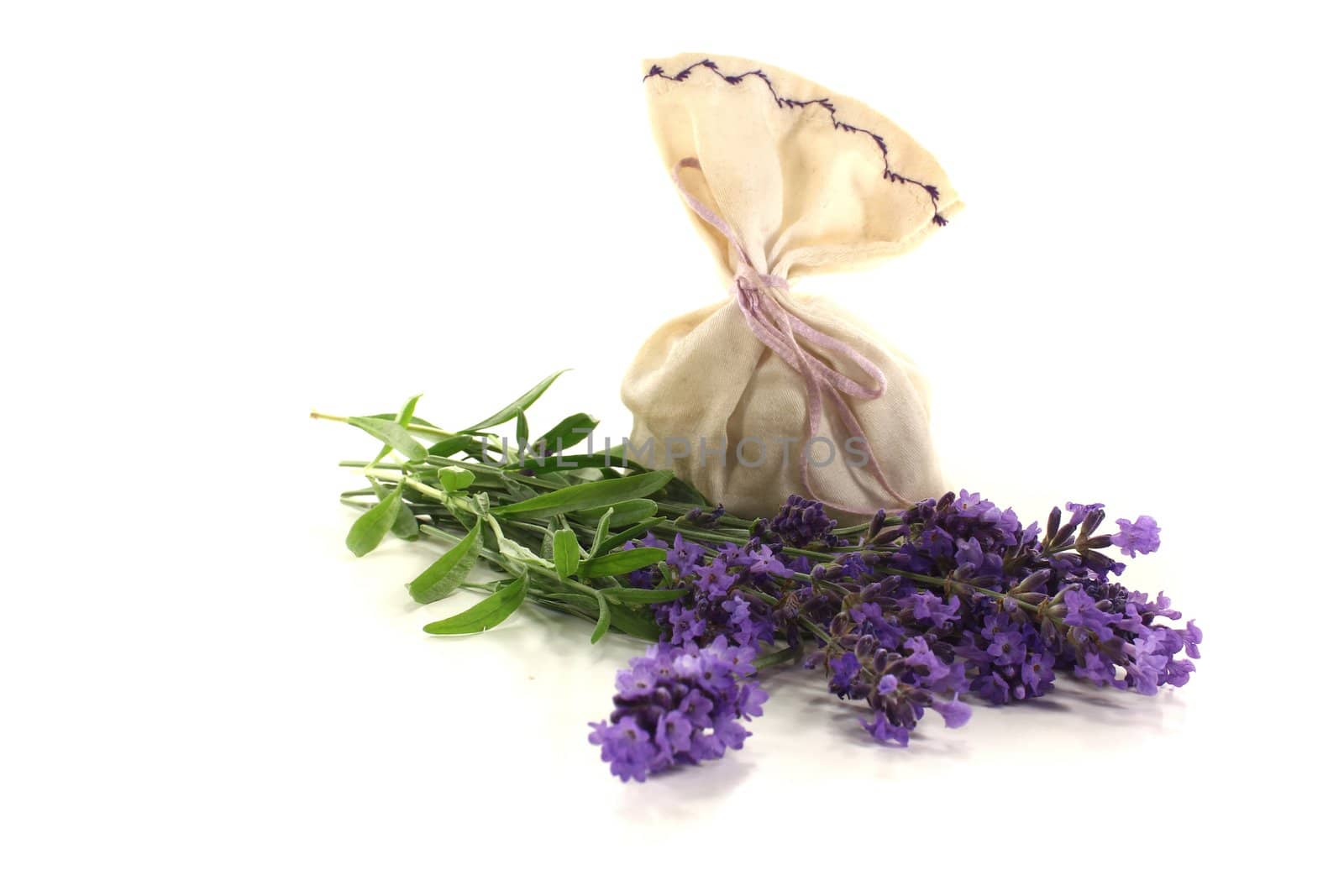 Lavender bag with flowers and leaves on a bright background