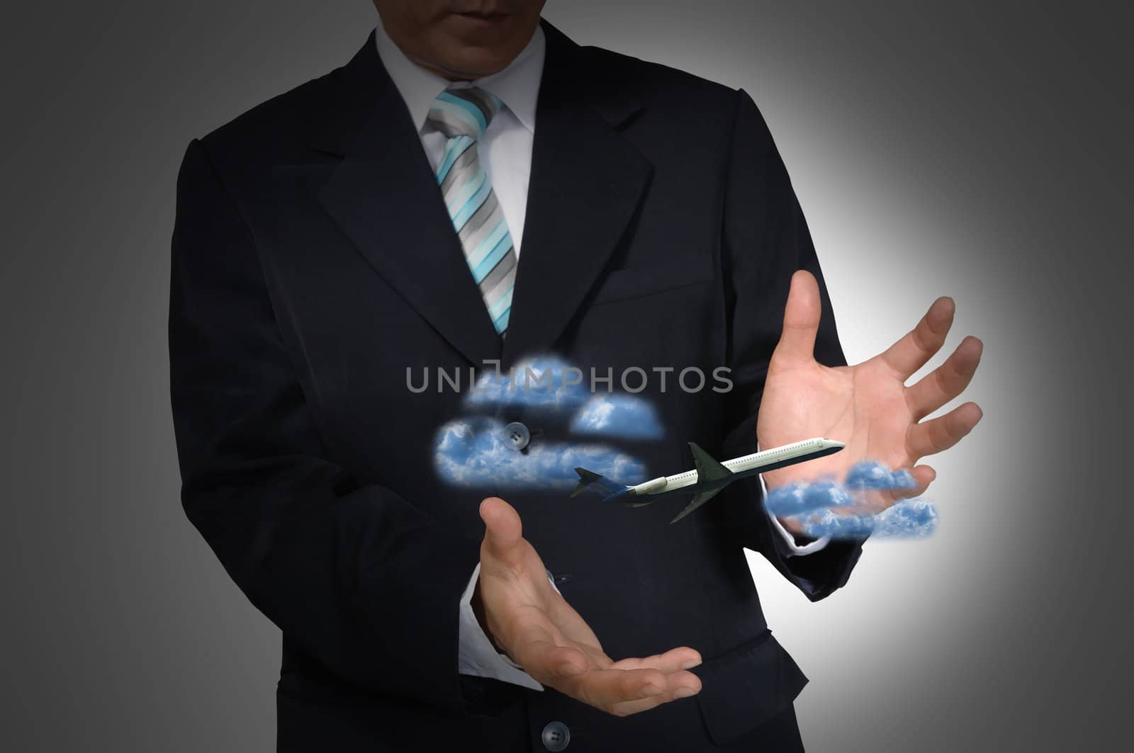 Airplane in the hand of business man by thampapon