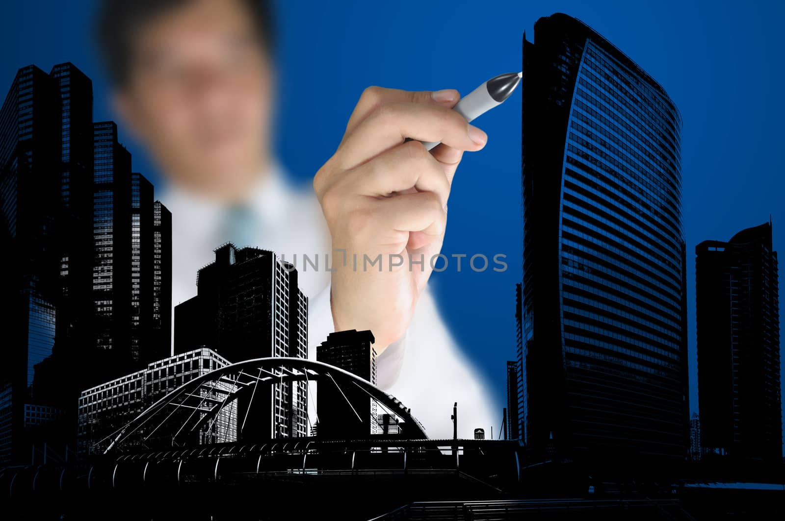 Business Man or Architect draw cityscape and building