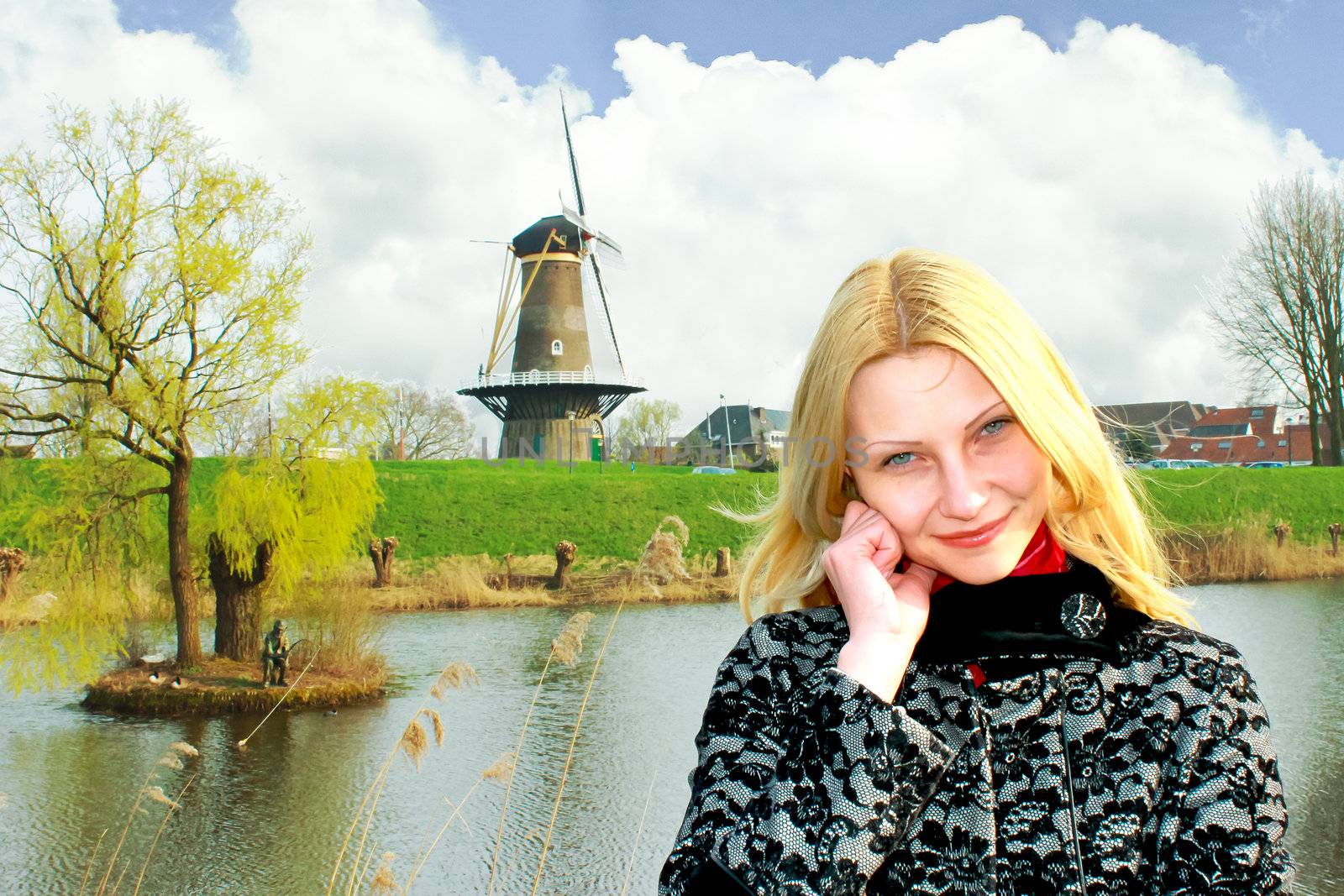 Girl on the waterfront in the Dutch town of Gorinchem. Netherlan by NickNick