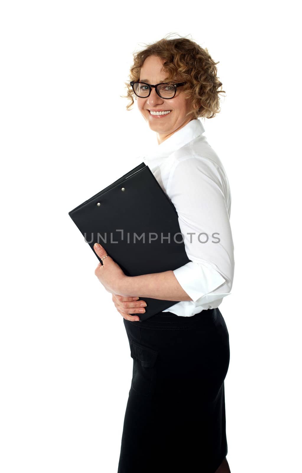 Smiling corporate woman posing with  clipboard against white background