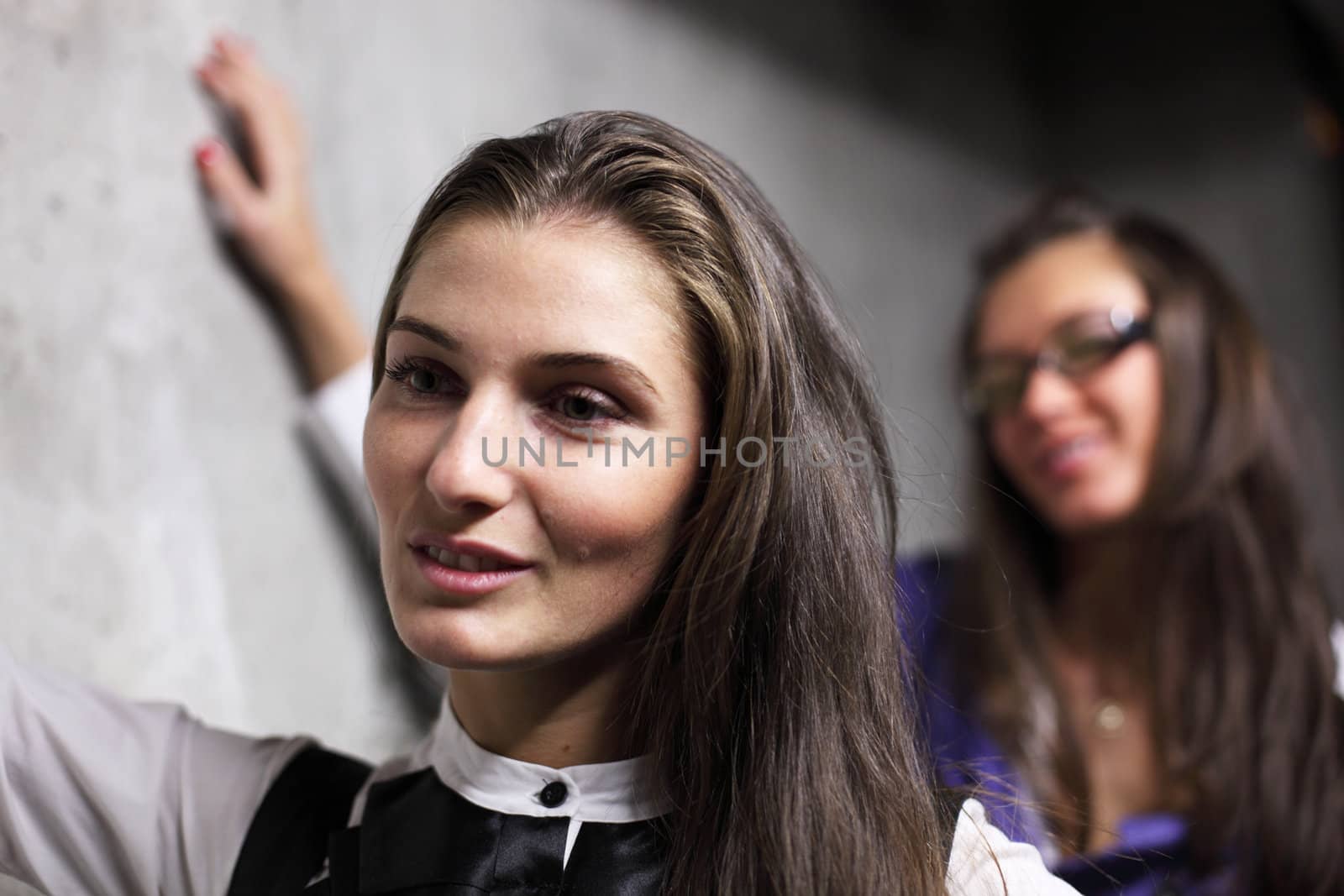 underground girlfriends around stone wall