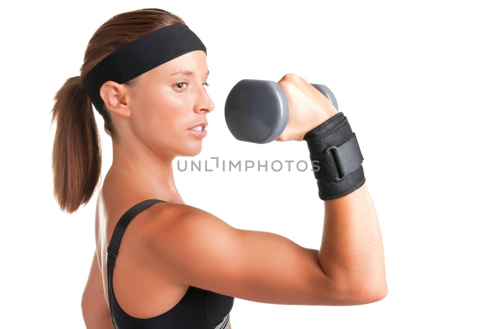 Woman working out with dumbbells at a gym