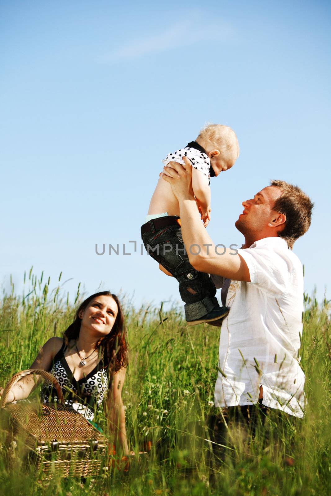 happy family in green grass