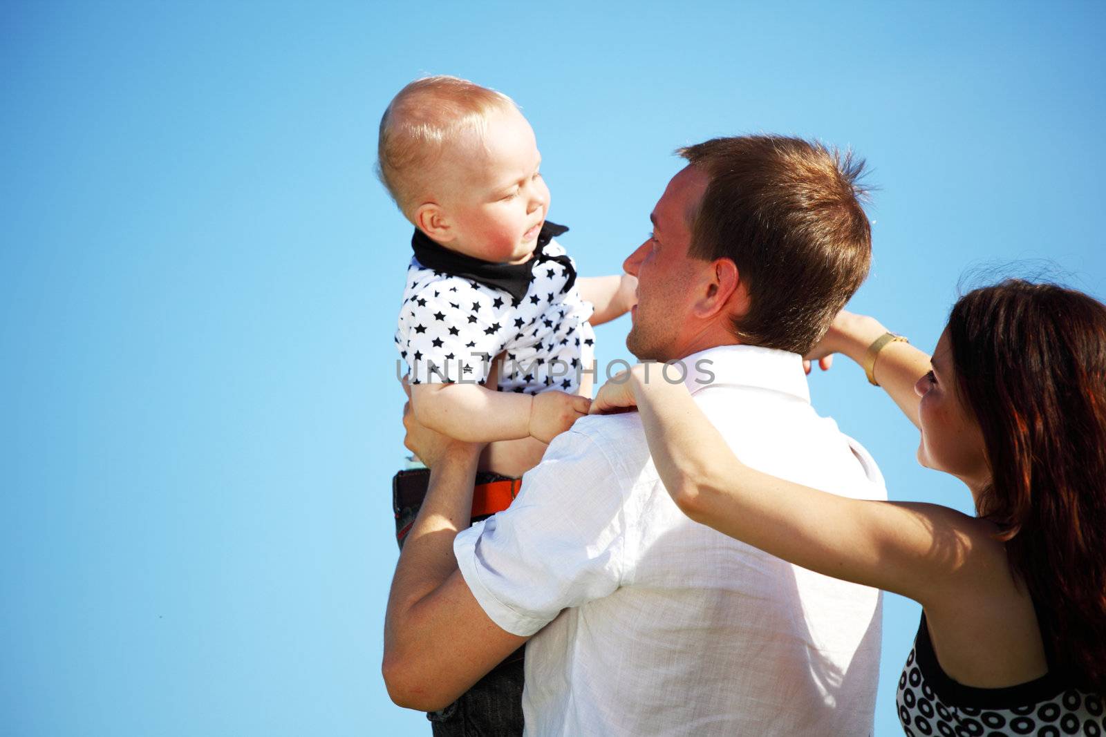 happy family blue sky on background