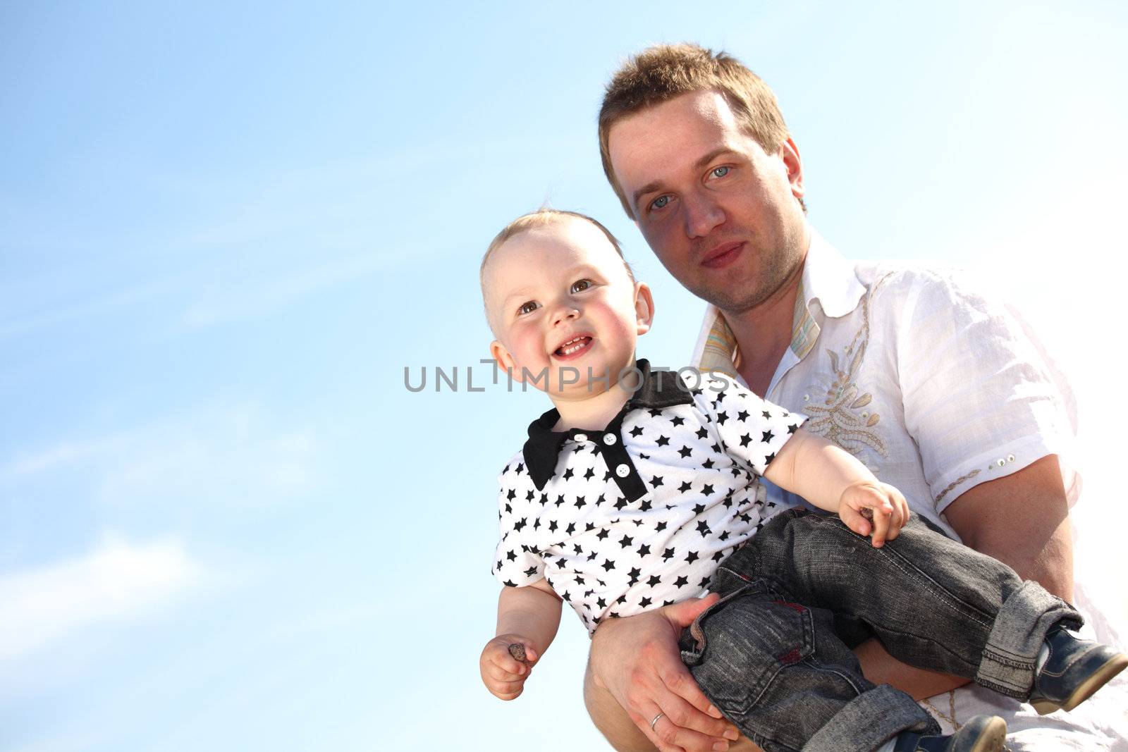 father and son in blue sky
