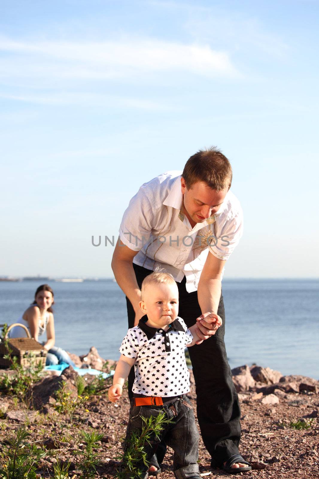 father and son walking on grass