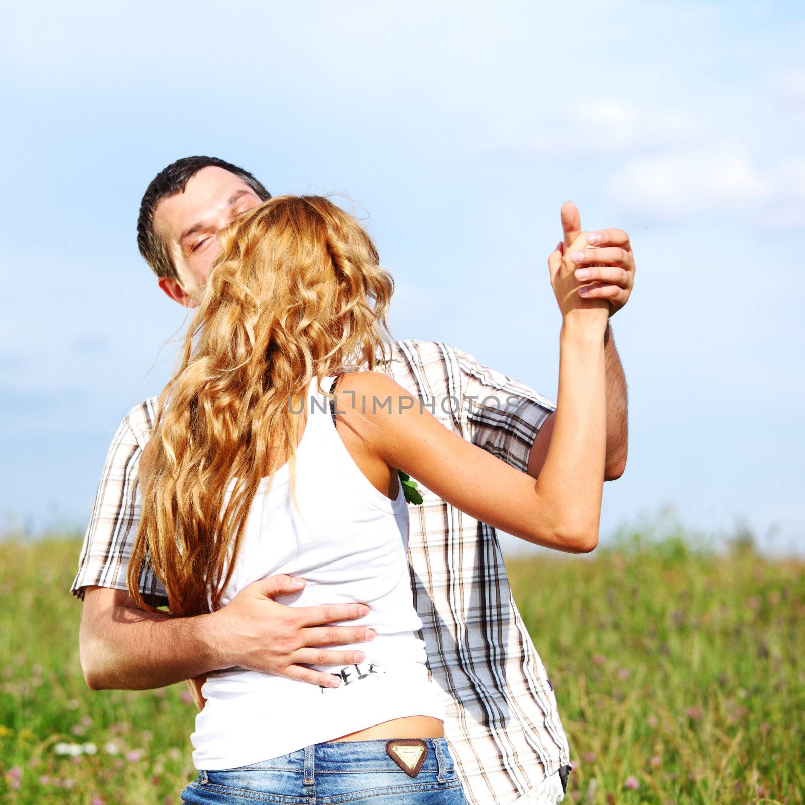 man and woman dance in the sky