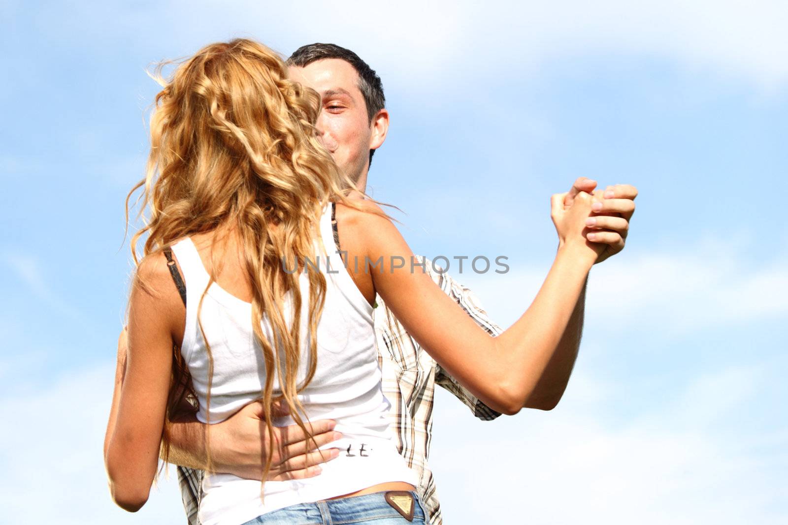 man and woman dance in the sky
