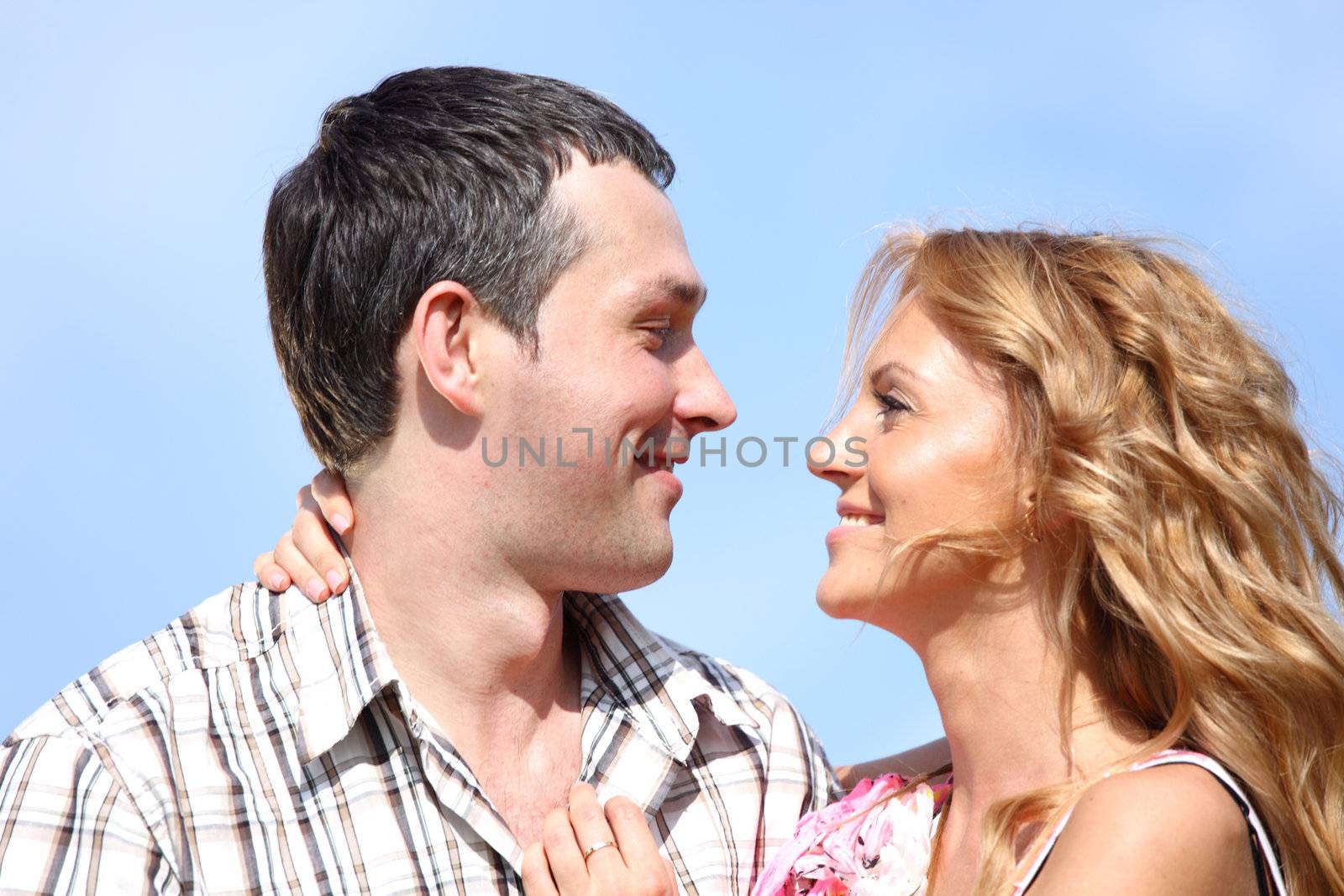 man and woman hug in the sky