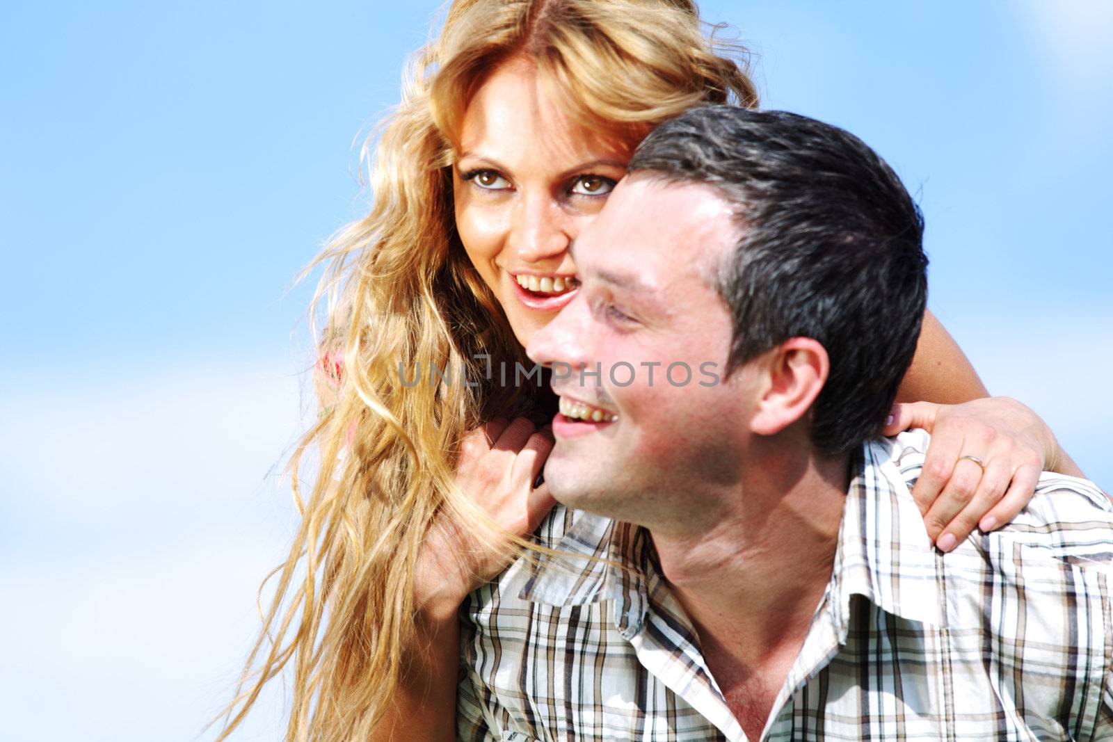man and woman hug in the sky