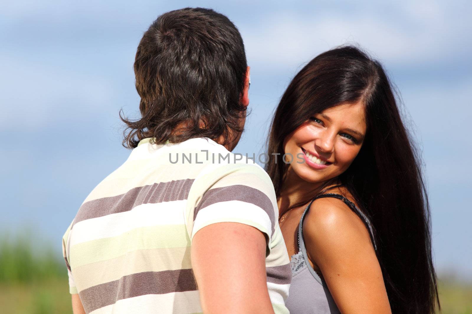 man and woman hug in the sky