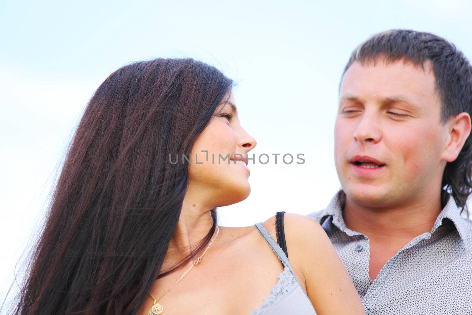 man and woman hug in the sky
