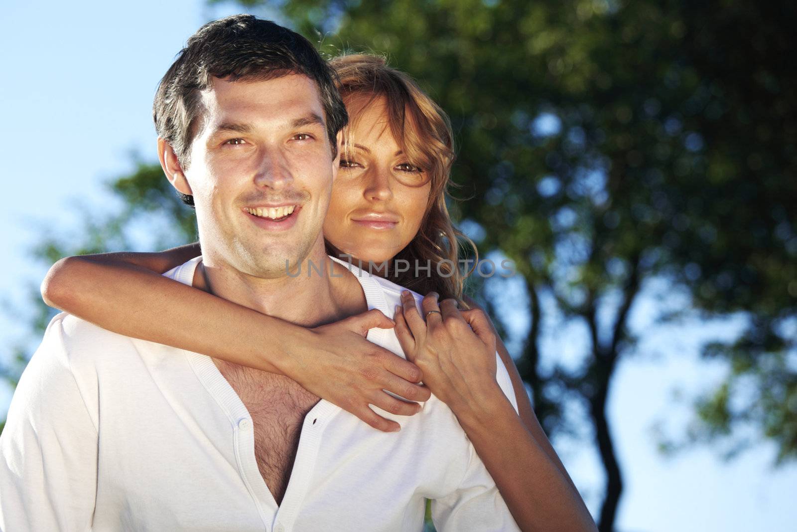 man and woman hug in the sky