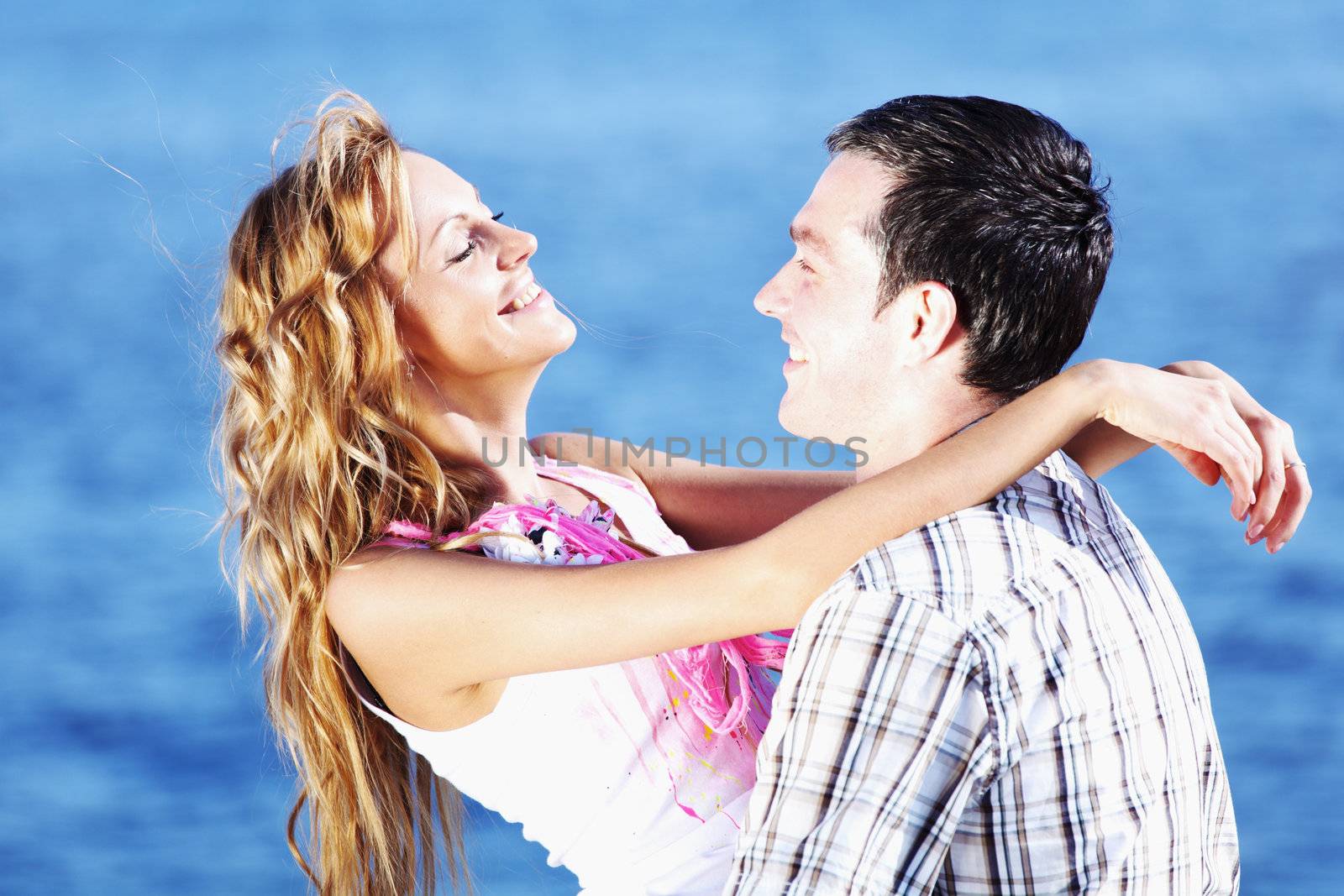 man and woman hug in the sky and sea on sea