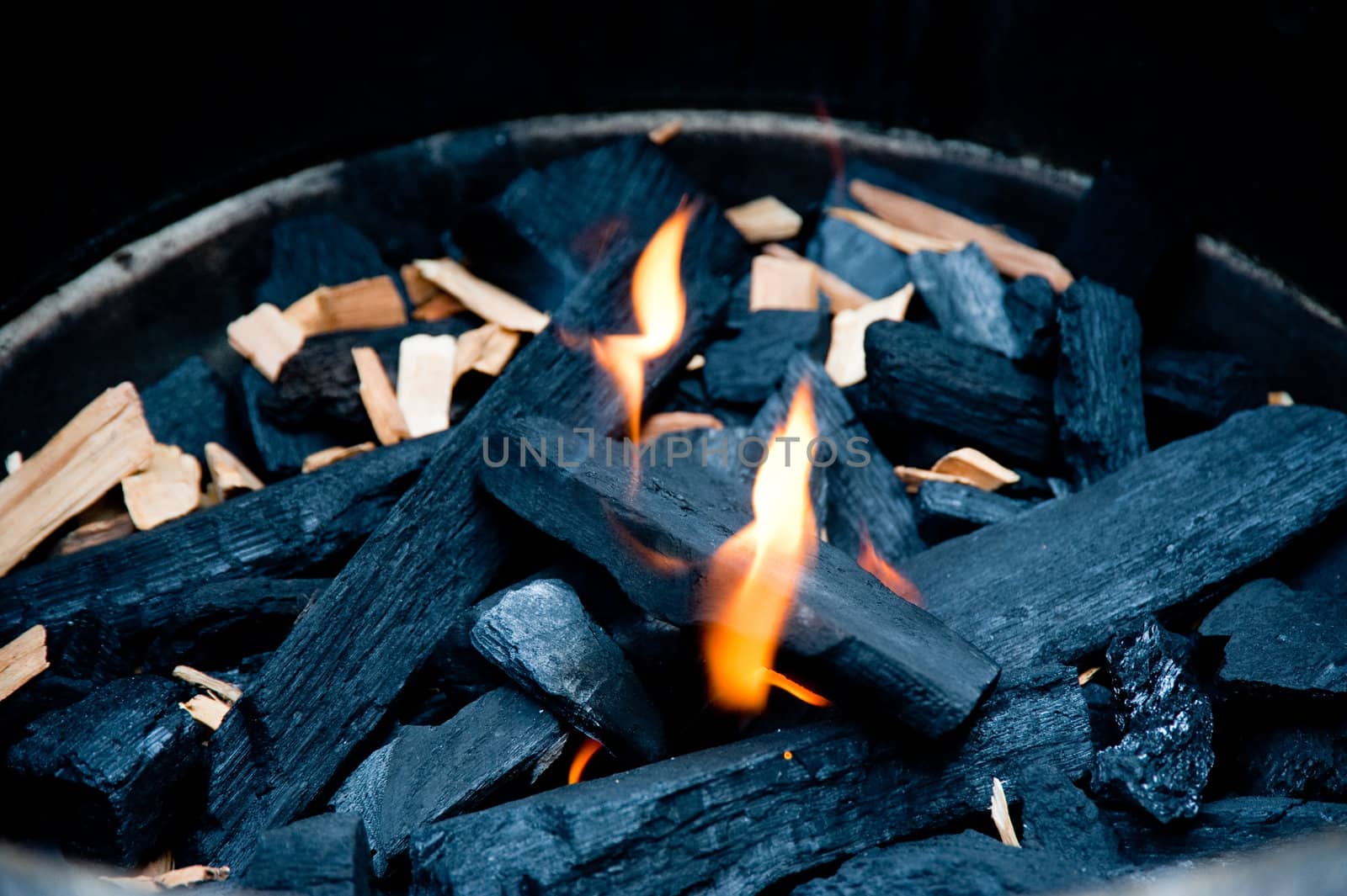 Flame and charcoal in a bbq grill