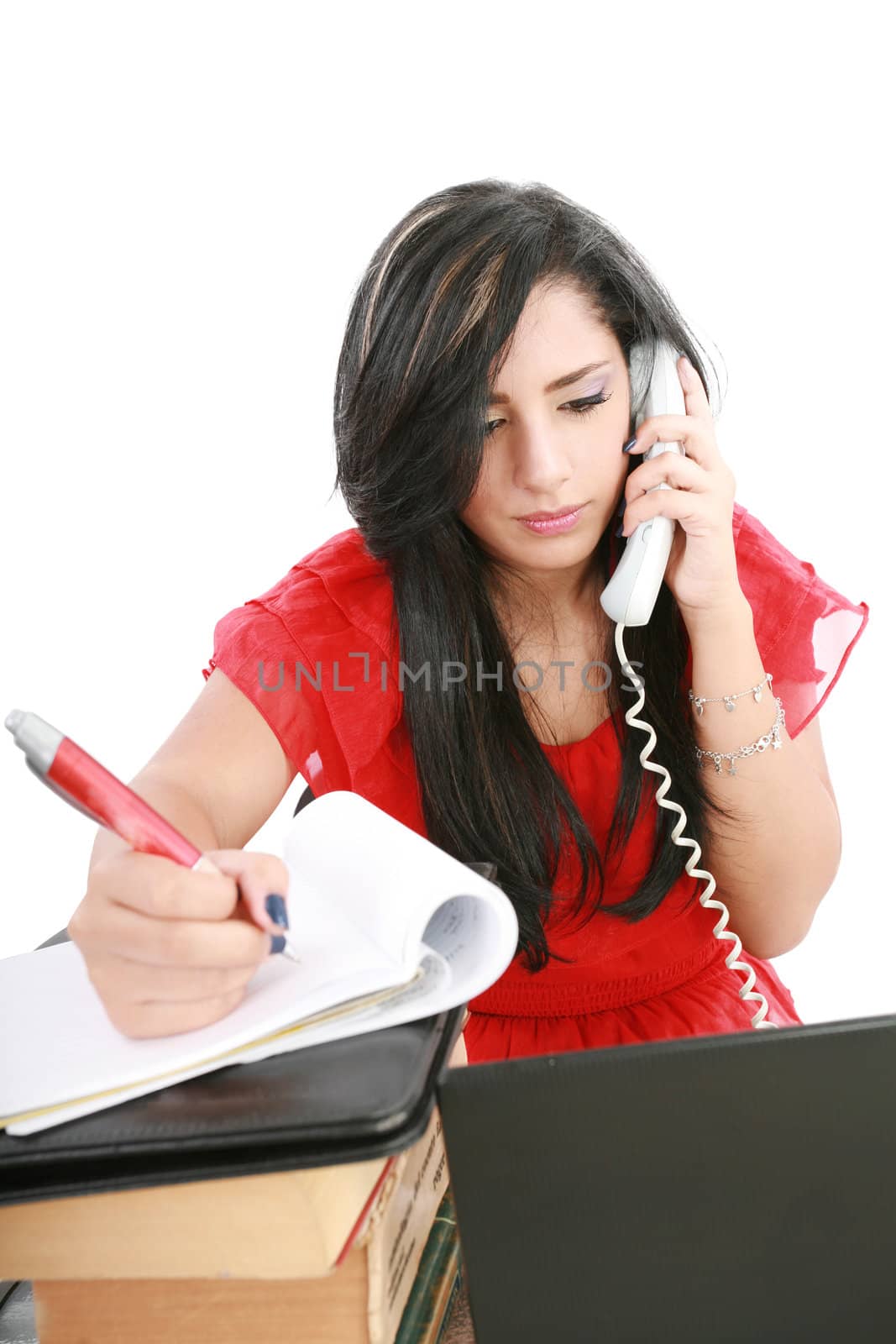 Busy businesswoman using mobile phone and take note