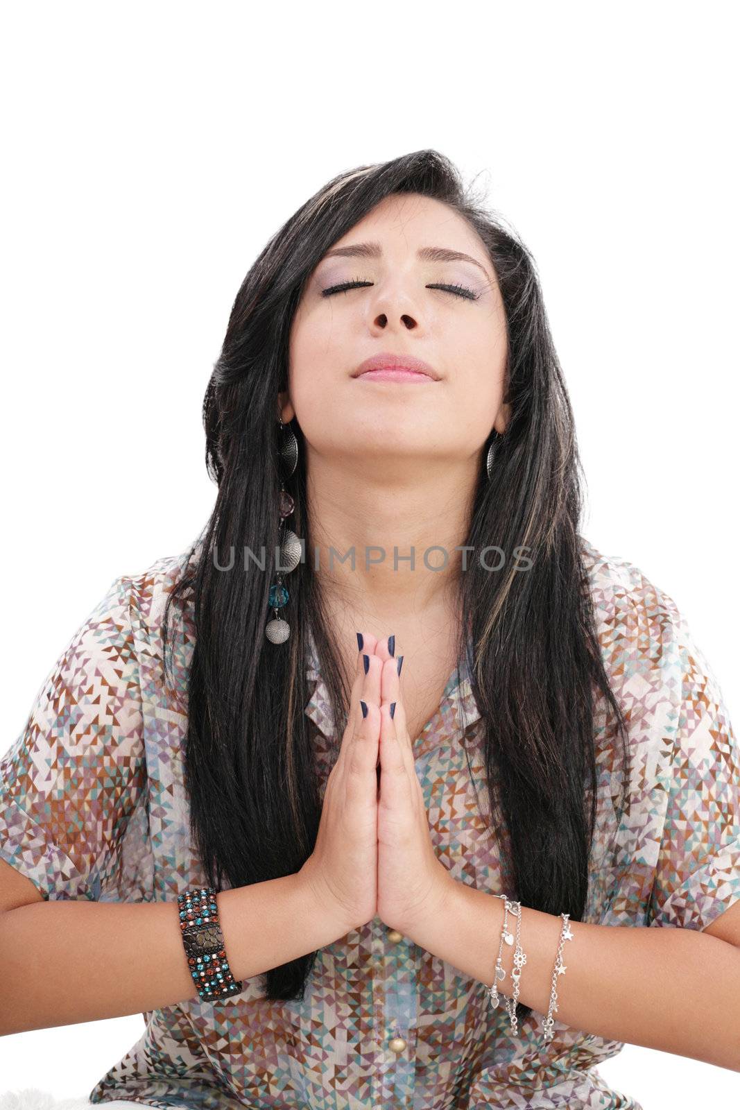 Closeup portrait of a young caucasian woman praying by dacasdo