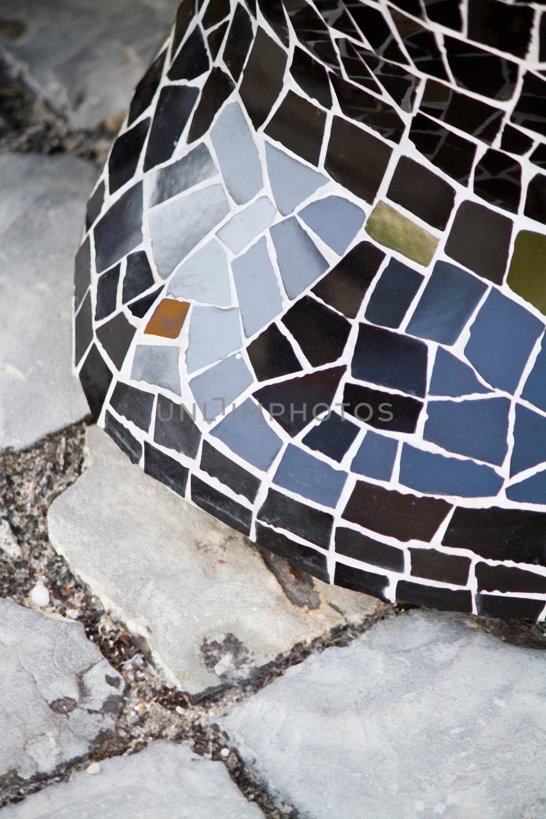 View of some detail of a colorful mosaic wall of ceramic broken tile.