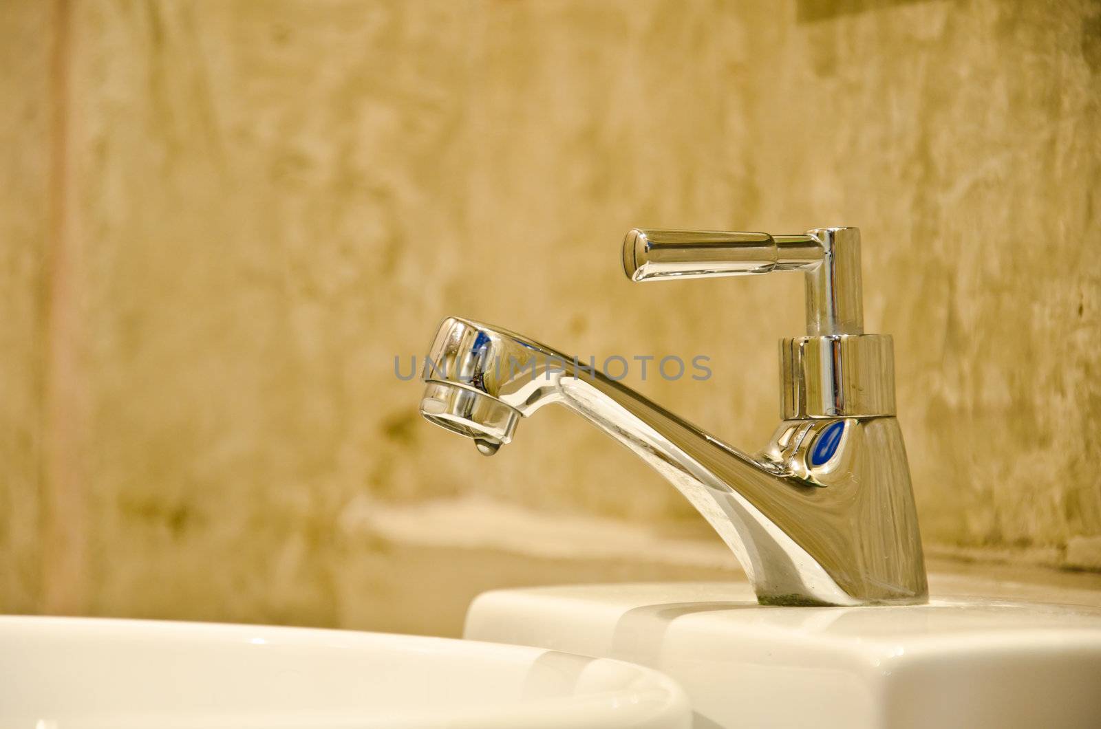 Stainless steel faucet in bathroom