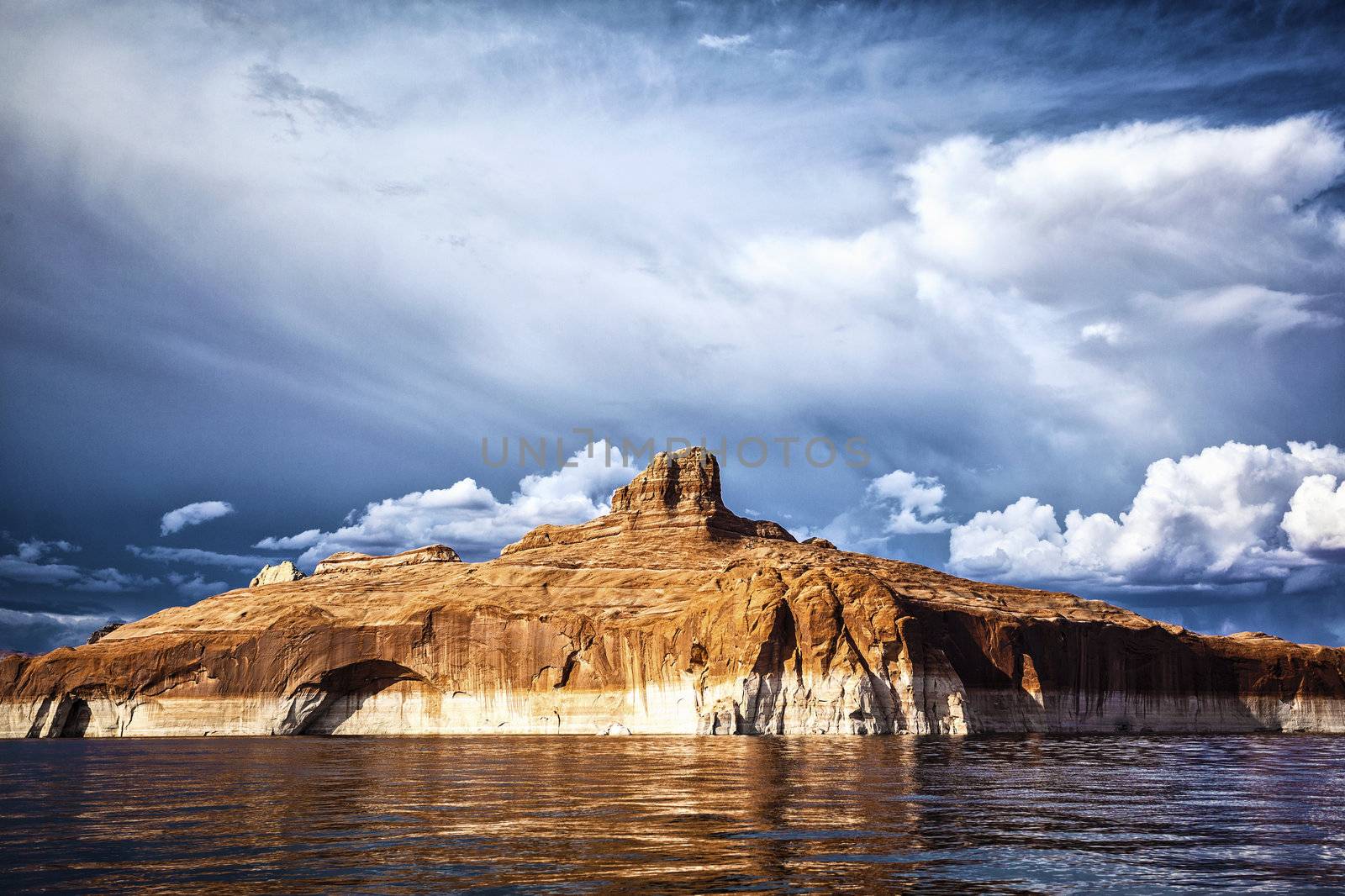 red cliffs reflected in the water of the lake Powell, USA