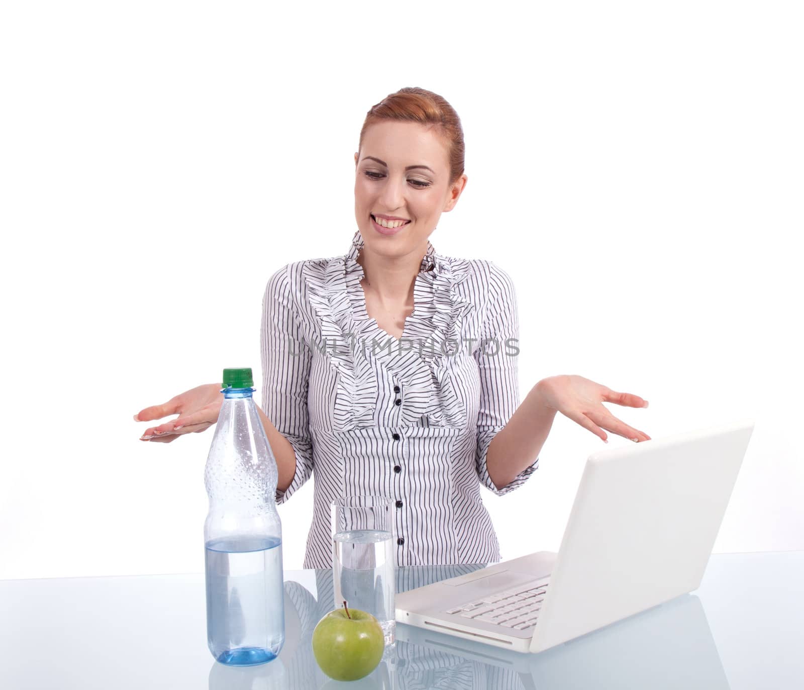 young business woman on computer with snack isolated on white