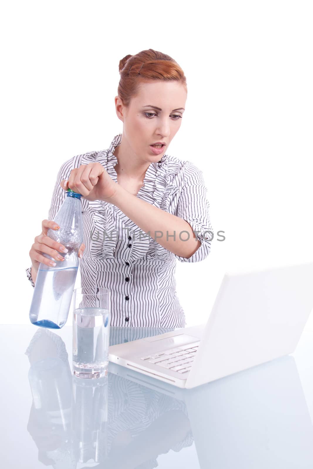 young business woman on computer with snack isolated on white