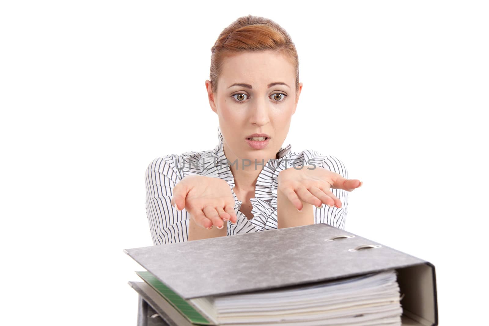 business woman in office looks at unbelievable folder stack isolated on white