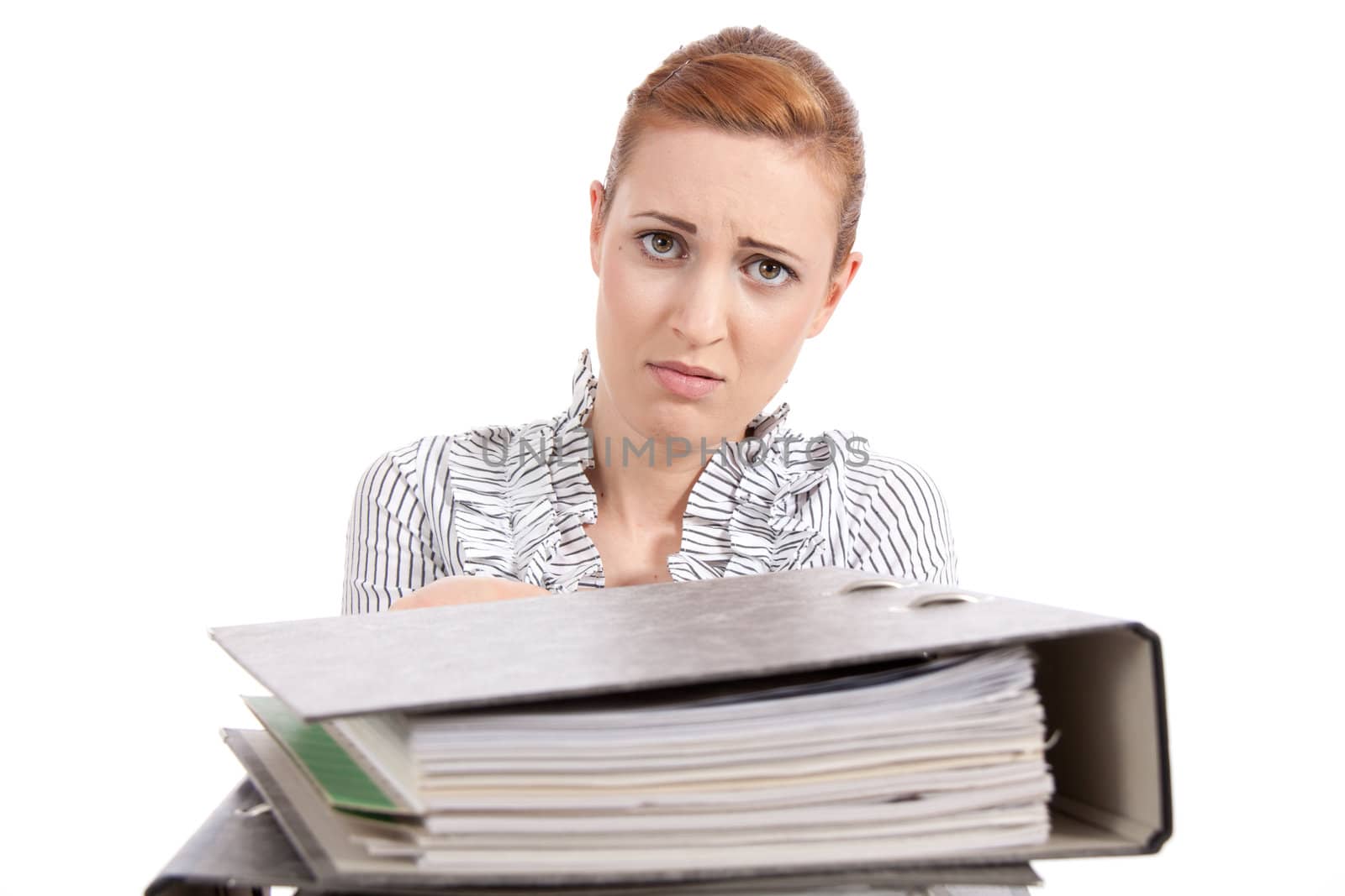 business woman in office looks at unbelievable folder stack isolated on white