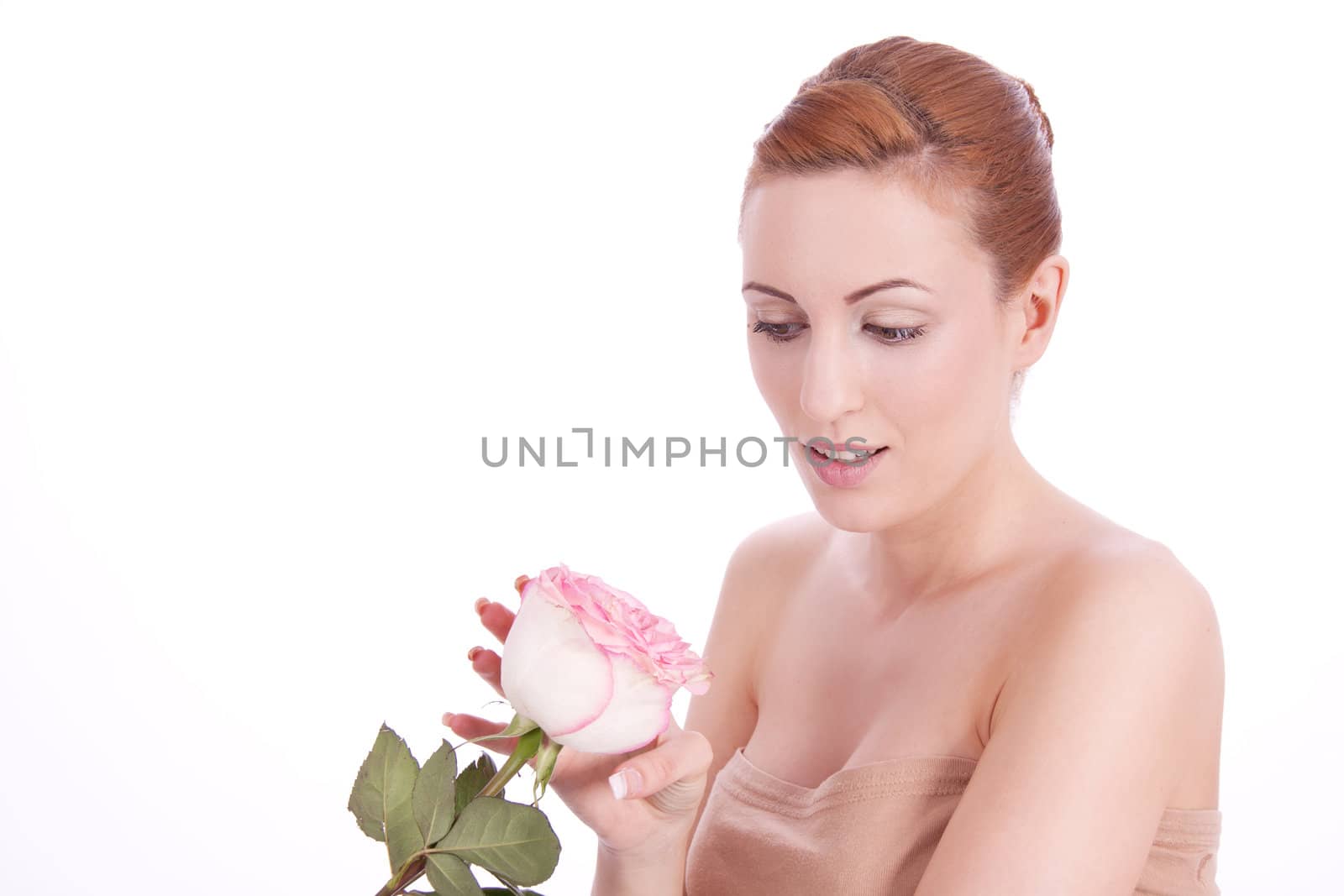 beautiful young woman holding pink rose isolated on white