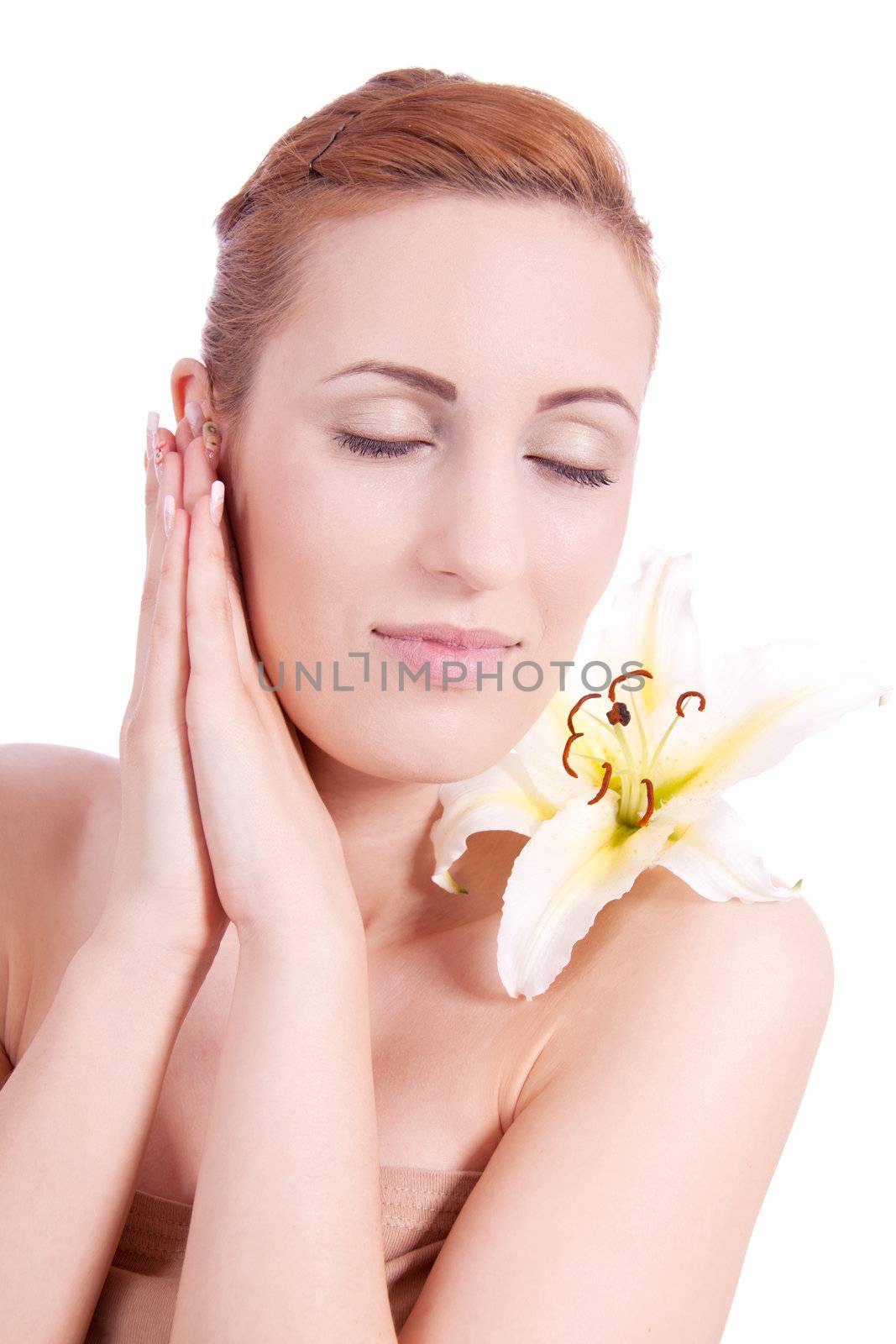 beautiful natural woman face with flower isolated on white