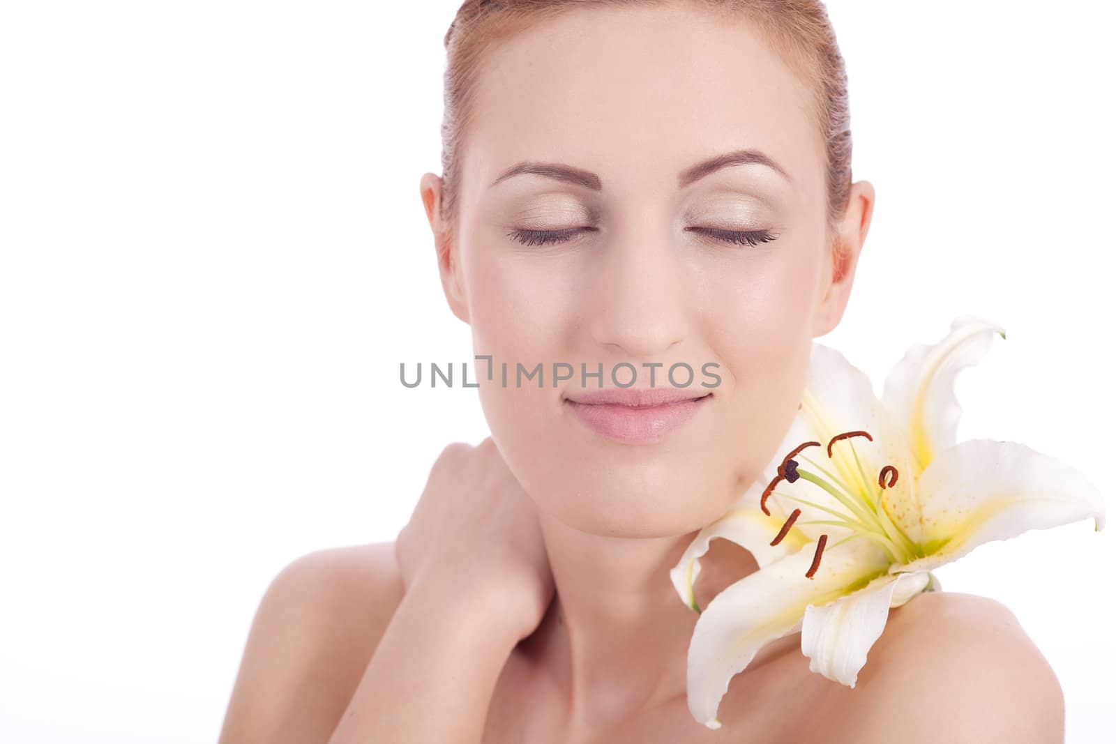 beautiful natural woman face with flower isolated on white