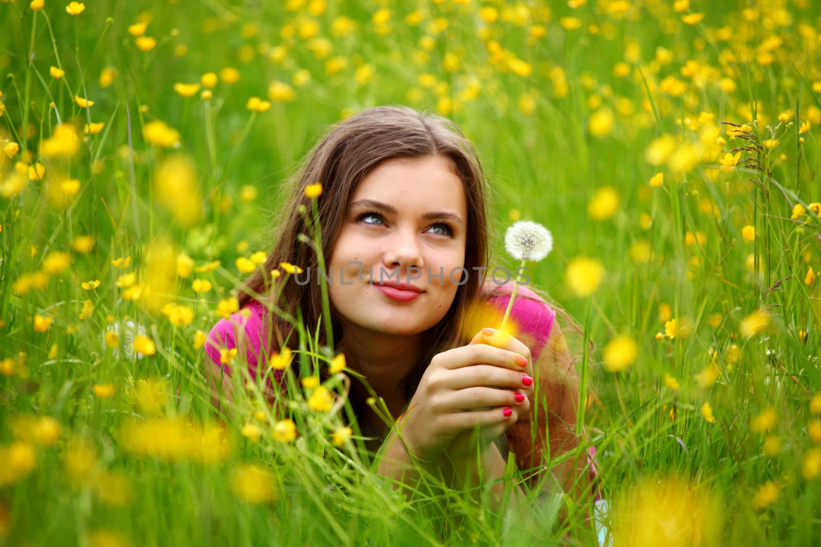 summer woman blow on dandelion 