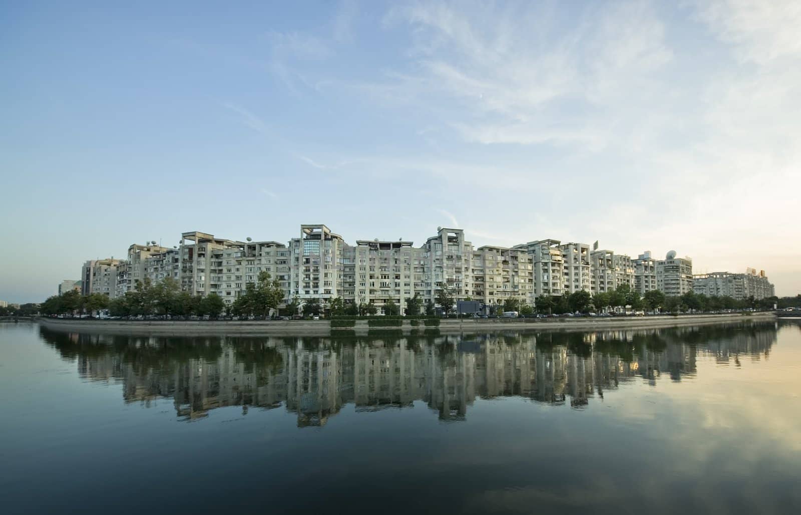Dambovita river and buildings reflected in water, Bucharest  Romania