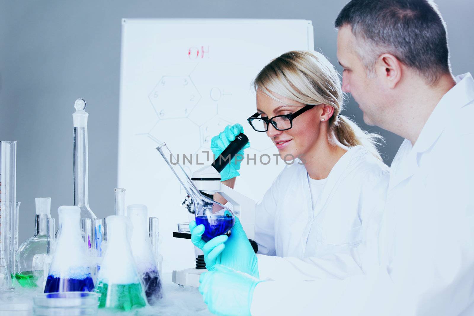  two scientist in chemical lab conducting experiments