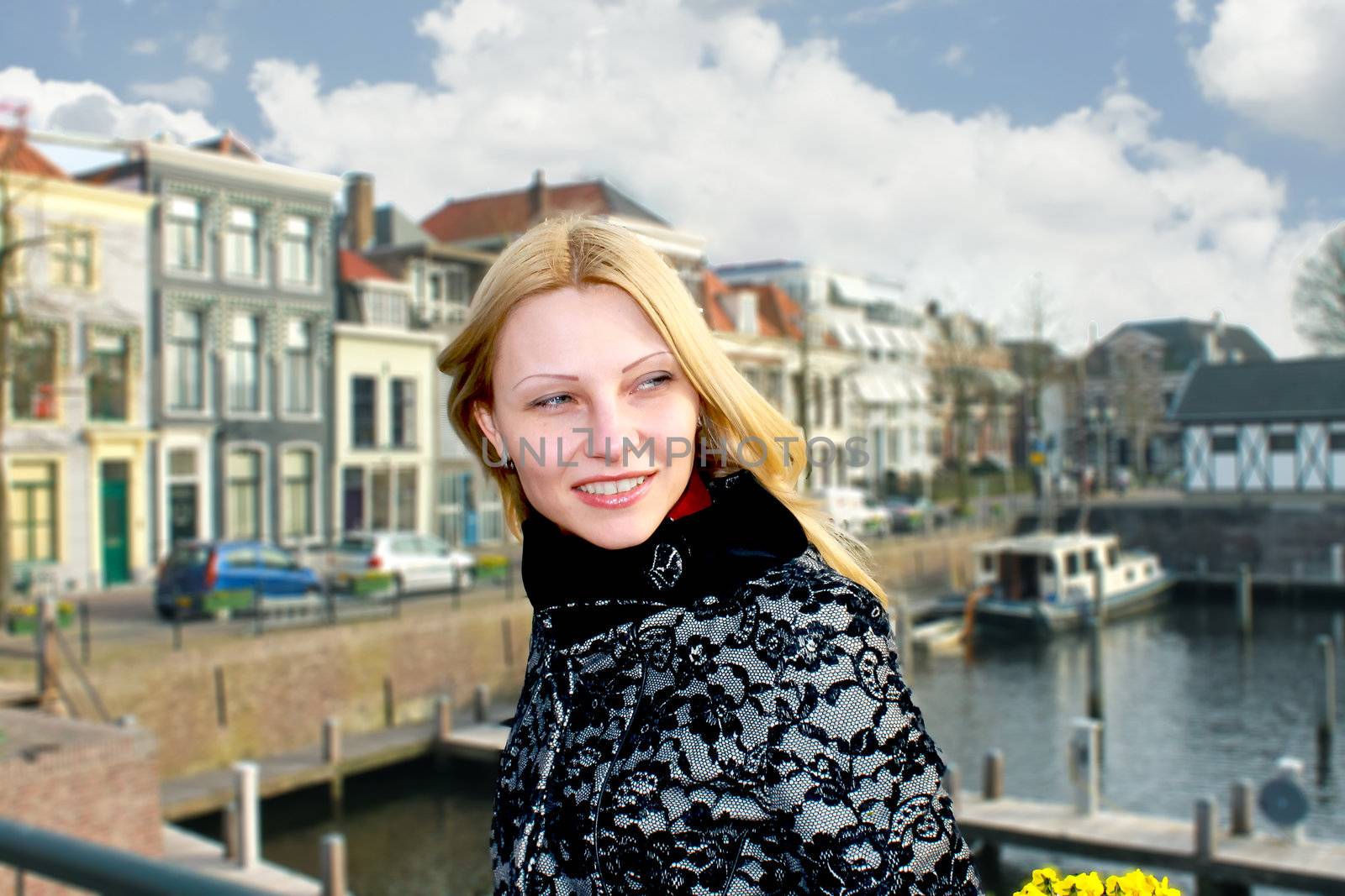 Girl on the waterfront in the Dutch town of Gorinchem. Netherlan by NickNick